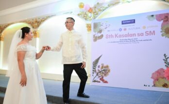 Harold Picar, wearing a barong Tagalog from Kultura, poses with his wife Katrina Rose, with Kultura having provided barong Tagalogs for all 16 grooms.