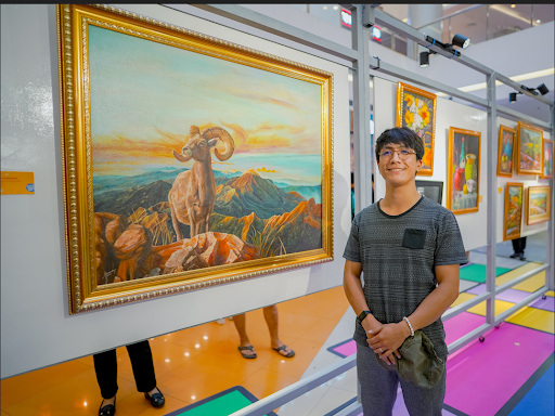 Artist and curator Kevin Fernandez at the SM City Iloilo Art Market, bringing his latest unique works to a wider audience.